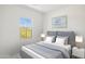 Bedroom with a queen bed, gray accents, and a window view at 6412 N 17Th Pl, Phoenix, AZ 85016