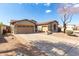 Single-story house with a three-car garage and landscaped front yard at 10112 S 185Th Dr, Goodyear, AZ 85338