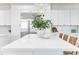 Kitchen island with white quartz countertop and stylish seating at 2662 N Chestnut Cir, Mesa, AZ 85213