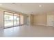 Bright living room with sliding glass doors leading to the backyard at 243 E Citrus Hollow Way, Queen Creek, AZ 85140