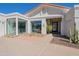 Modern home with a glass-paneled entryway and landscaped walkway at 9175 N 82 St, Scottsdale, AZ 85258