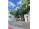 Building exterior showcasing landscaping and a large tree at 3119 W Cochise Dr # 225, Phoenix, AZ 85051