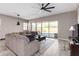 Spacious living room with sliding doors leading to the backyard and a neutral color scheme at 23142 E Thornton Rd, Queen Creek, AZ 85142