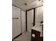 Modern bathroom with a white vanity, stone-look tile floor, and linen closet at 3119 W Cochise Dr # 225, Phoenix, AZ 85051