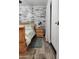 Sleigh bed in bedroom with whitewashed brick feature wall at 3119 W Cochise Dr # 225, Phoenix, AZ 85051