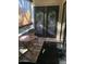 Small patio with table and chairs, featuring decorative doors at 3119 W Cochise Dr # 225, Phoenix, AZ 85051
