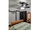 Sleigh bed in bedroom with whitewashed brick feature wall at 3119 W Cochise Dr # 225, Phoenix, AZ 85051