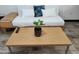 Light wood coffee table with a potted plant on it at 3119 W Cochise Dr # 225, Phoenix, AZ 85051