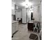 Open concept kitchen and dining area with white cabinets at 3119 W Cochise Dr # 225, Phoenix, AZ 85051