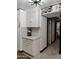 White kitchen cabinets and quartz countertops with geometric backsplash at 3119 W Cochise Dr # 225, Phoenix, AZ 85051
