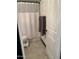 Clean bathroom with shower/tub combo, toilet, and white tile flooring at 3119 W Cochise Dr # 225, Phoenix, AZ 85051
