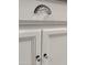 White kitchen cabinets with glass knobs and pulls at 3119 W Cochise Dr # 225, Phoenix, AZ 85051