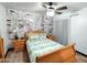 Sleigh bed in bedroom with whitewashed brick feature wall at 3119 W Cochise Dr # 225, Phoenix, AZ 85051