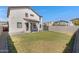 Large backyard with grassy area and patio at 10763 W Beatrice St, Avondale, AZ 85323