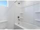 Simple bathroom with a shower/tub combo and built-in shelving at 10763 W Beatrice St, Avondale, AZ 85323