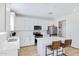 Modern kitchen with white cabinets, quartz countertops, and island at 10763 W Beatrice St, Avondale, AZ 85323