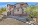 Two-story home with brick and siding exterior, landscaping, and a walkway at 10763 W Beatrice St, Avondale, AZ 85323