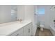 Clean bathroom with a single vanity, toilet, and bathtub at 10763 W Beatrice St, Avondale, AZ 85323