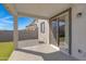 Covered patio with sliding glass doors at 10763 W Beatrice St, Avondale, AZ 85323