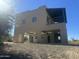 Two-story home with attached garage and balcony at 1140 Jediondia Dr, Wickenburg, AZ 85390