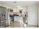 Modern kitchen features stainless steel appliances and ample cabinetry at 7119 W Roma Ave, Phoenix, AZ 85033