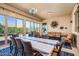 Sunroom with seating and dining areas at 42086 W Solitare Dr, Maricopa, AZ 85138