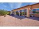 Landscaped backyard with gravel and grilling area at 42086 W Solitare Dr, Maricopa, AZ 85138