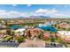 Aerial view of community with lake and amenities at 42086 W Solitare Dr, Maricopa, AZ 85138