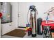 Garage with water softener and extra storage at 42086 W Solitare Dr, Maricopa, AZ 85138