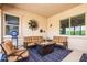 Relaxing patio with seating area and fire pit at 42086 W Solitare Dr, Maricopa, AZ 85138