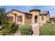Tan two-story house with a two-car garage at 42086 W Solitare Dr, Maricopa, AZ 85138