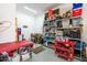 Organized garage workshop with ample storage at 42086 W Solitare Dr, Maricopa, AZ 85138