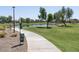 Community park with a pond and walking paths at 36503 W San Ildefanso Ave, Maricopa, AZ 85138