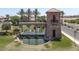 Gated community entrance with a water feature and landscaping at 36503 W San Ildefanso Ave, Maricopa, AZ 85138