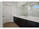 Modern bathroom with double vanity and glass shower at 17279 W Dartmouth St, Surprise, AZ 85388