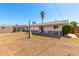 Large backyard with grassy area and shed at 3608 W Glenn Dr, Phoenix, AZ 85051