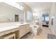 Elegant Primary bathroom with double vanity, soaking tub, and separate shower at 18226 W Desert Willow Dr, Goodyear, AZ 85338