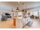 Large kitchen with island, granite counters, and stainless steel appliances at 18226 W Desert Willow Dr, Goodyear, AZ 85338