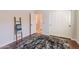 Cozy bedroom with hardwood floors, a large closet, and a view of the bathroom at 18226 W Desert Willow Dr, Goodyear, AZ 85338
