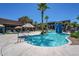 Resort-style pool with a waterfall feature and lounge area at 18226 W Desert Willow Dr, Goodyear, AZ 85338