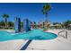 Sparkling community pool with surrounding lounge area at 18226 W Desert Willow Dr, Goodyear, AZ 85338