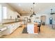 Spacious kitchen with an island, stainless steel appliances, and white shaker cabinets at 18226 W Desert Willow Dr, Goodyear, AZ 85338