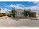 Mobile home with covered carport and desert landscaping at 11596 W Sierra Dawn Blvd # 157, Surprise, AZ 85378