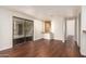 Living room with hardwood floors, sliding door, and built-ins at 11596 W Sierra Dawn Blvd # 157, Surprise, AZ 85378
