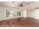Bright living room with wood-look flooring and ceiling fan at 11596 W Sierra Dawn Blvd # 157, Surprise, AZ 85378