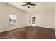 Bright bedroom with wood-look flooring and ceiling fan at 11596 W Sierra Dawn Blvd # 157, Surprise, AZ 85378