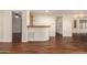 Built-in wet bar with wood countertop and shelving at 11596 W Sierra Dawn Blvd # 157, Surprise, AZ 85378