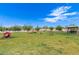 Community dog park with agility equipment and seating at 11596 W Sierra Dawn Blvd # 157, Surprise, AZ 85378