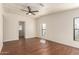 Spacious bedroom with wood-look floors and access to another room at 11596 W Sierra Dawn Blvd # 157, Surprise, AZ 85378
