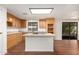 Kitchen boasts an island and wood cabinets at 11596 W Sierra Dawn Blvd # 157, Surprise, AZ 85378